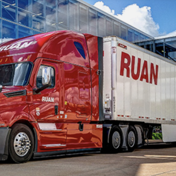 Ruan tractor-trailer in front of modern building
