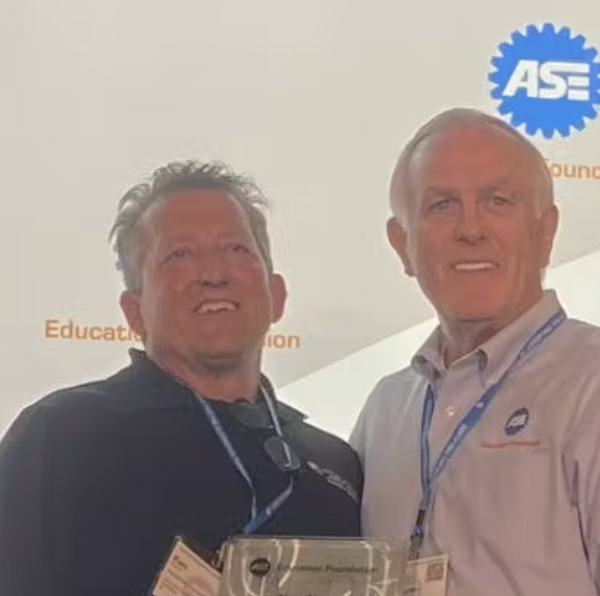Ken Kunz (left) and Mike Coley, ASE Education Foundation president, at the ASE Instructor Training Conference in St. Louis.