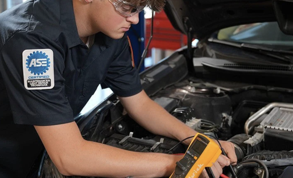Professional technician working on engine