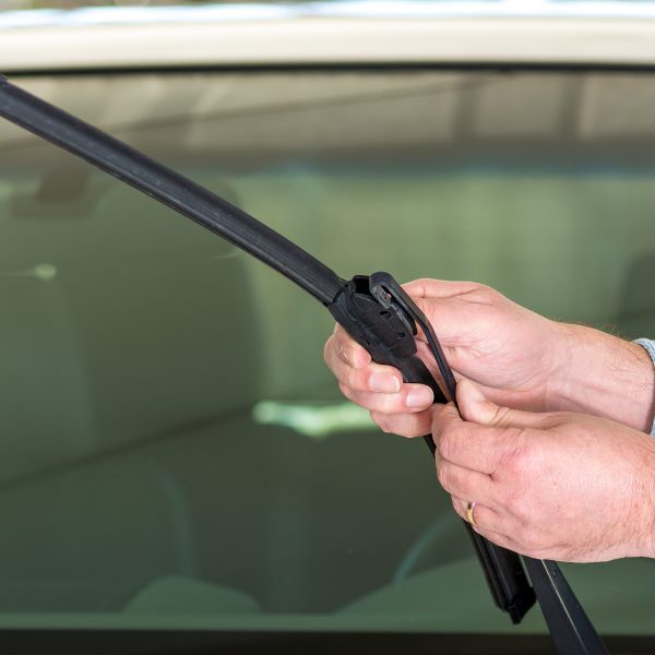 Technician attaching wiper blade